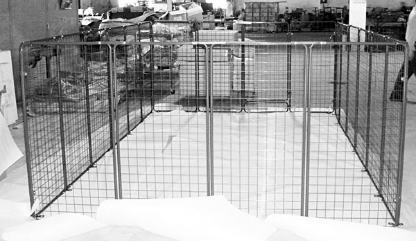garden fence is made of study construction of interlocking 2-by-4 foot light green panels with steel frames and tight mesh screen made to last for years of use.